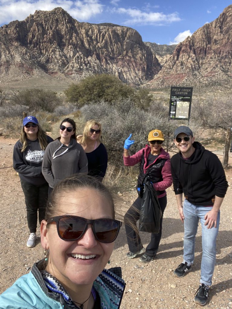 Cactus Collective team smiling at the camera, standing outdoors in Vegas desert.